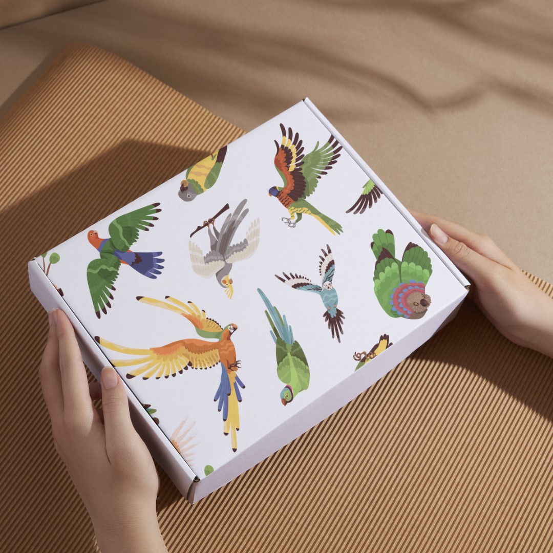 Caja en cartón con aves impresas